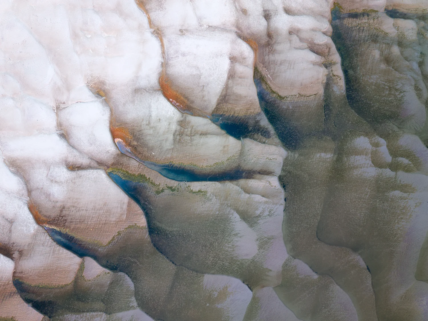 Abstract drone photography of Danube riverbed formations resembling a human skull.